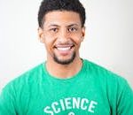 Portrait of a smiling young man wearing a green T-shirt with science text.